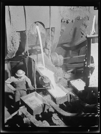Untitled photo, possibly related to: Garfield, Utah. Making molds of blister copper at the Garfield smelter of the American Smelting and Refining Ccompany