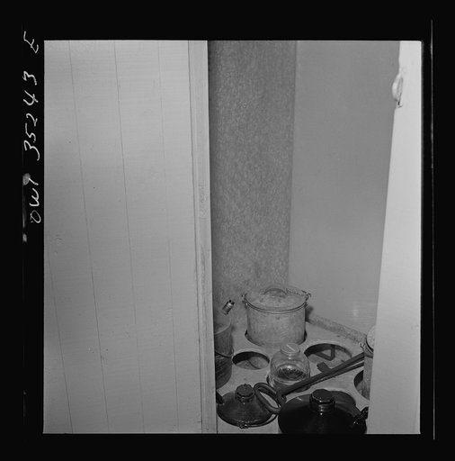 Clovis, New Mexico. Compartment in a new Atchison, Topeka and Santa Fe Railroad caboose containing oil and grease for journal boxes