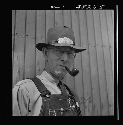 Conductor E.K. Hill of Amarillo, Texas, on the Atchison, Topeka and Santa Fe Railroad between Amarillo, Texas and Clovis, New Mexico