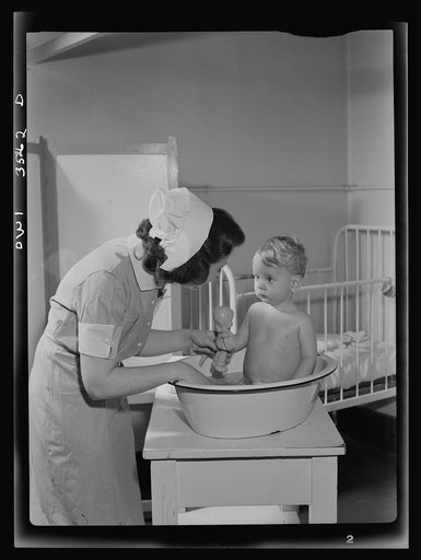 Johns Hopkins Hospital, Baltimore, Maryland. Student nurse at work in the pediatric ward