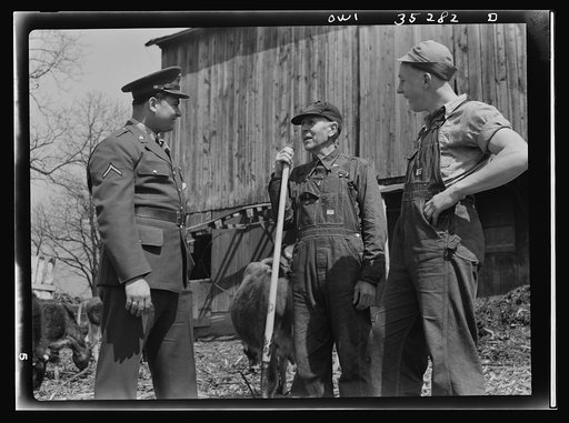 Rockville (vicinity), Maryland. Private Harvey Horton, visiting the N.C. Stiles dairy farm while on furlough from Fort Belvoir, Virginia, talking with Mr. Stiles and sixteen-year-old Charles Stiles