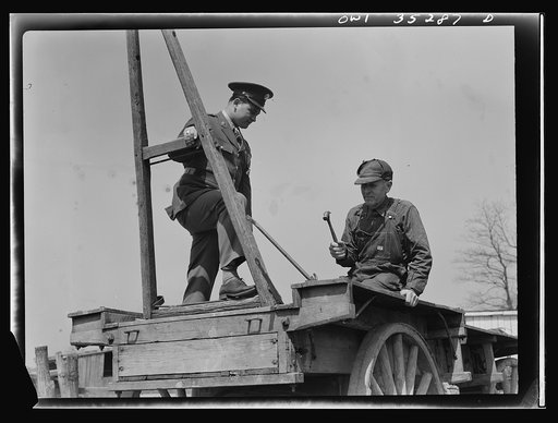 Rockville (vicinity), Maryland. Private Harvey Horton, visiting the N.C. Stiles dairy farm while on furlough from Fort Belvoir, Virginia, with Mr. Stiles