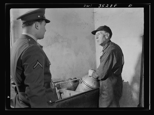 Rockville (vicinity), Maryland. Private Harvey Horton, visiting the N.C. Stiles dairy farm while on furlough from Fort Belvoir, Virginia, talking with Mr. Stiles