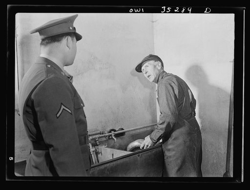 Rockville (vicinity), Maryland. Private Harvey Horton, visiting the N.C. Stiles dairy farm while on furlough from Fort Belvoir, Virginia, talking with Mr. Stiles