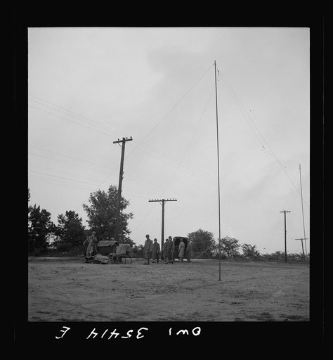 Untitled photo, possibly related to: Greenville, South Carolina. Air Service Command. Men of the 1067th signal company of the 25th service group operating a field radio
