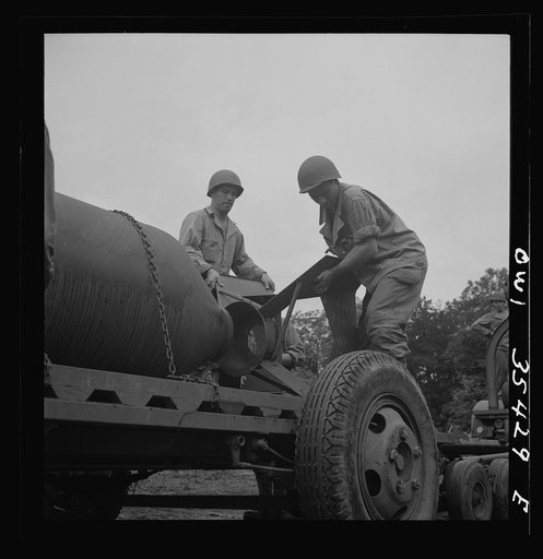Greenville, South Carolina. Air Service Command. Men of the 1756th ordnance supply and maintenance company removing the fins of a 4000 pound bomb
