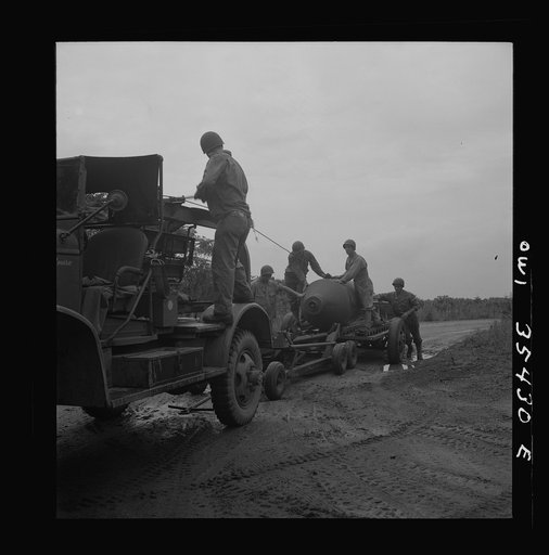 Untitled photo, possibly related to: Greenville, South Carolina. Air Service Command. Men of the 1756th ordnance supply and maintenance company removing the fins of a 4000 pound bomb