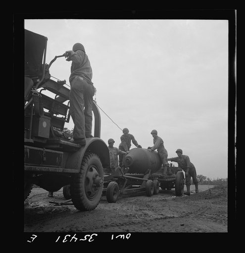 Greenville, South Carolina. Air Service Command. Men of the ordnance supply and maintenance company taking a 4000 pound bomb out of the revetment area