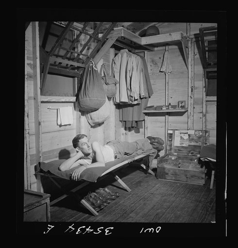 Greenville, South Carolina. Air Service Command. Enlisted man of the 25th service group relaxing in his hutment