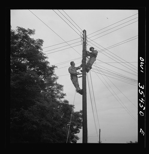 Untitled photo, possibly related to: Greenville, South Carolina. Air Service Command. Men of the 1067th signal company of the 25th service group stringing telephone wire