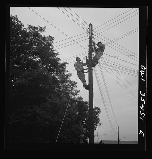 Greenville, South Carolina. Air Service Command. Men of the 1067th signal company of the 25th service group stringing telephone wire