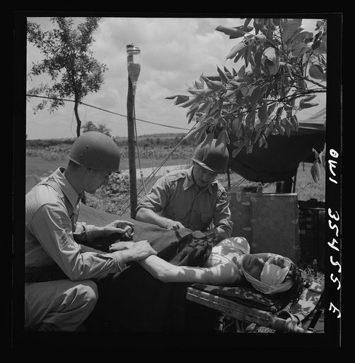 Greenville, South Carolina. Men of the medical unit of the 25th service group demonstrating a blood plasma transfusion under simulated field conditions