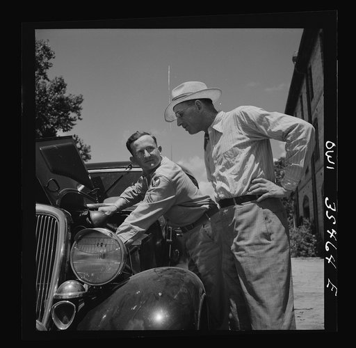 Untitled photo, possibly related to: Bowman, South Carolina. Sergeant John Riley of the 25th service group, Air Service Command, on leave at his home. He is tuning up his old Ford, preparing to go see his girlfriend