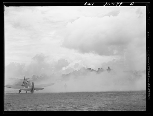 Untitled photo, possibly related to: Greenville, South Carolina. Air Service Command. Men of the 35th service squadron of the 25th service group enacting an "alert" during a simulated defense of the airfield from attack