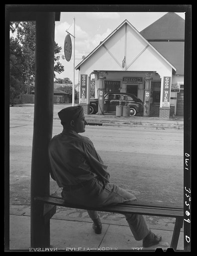 Bowman, South Carolina. Sergeant John Riley, of the 25th service group, Air Service Command, home on leave. Across the street is his father's garage, where he used to work