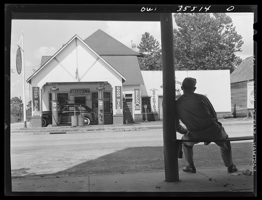 Bowman, South Carolina. Sergeant John Riley, of the 25th service group, Air Service Command, home on leave. Across the street is his father's garage, where he used to work