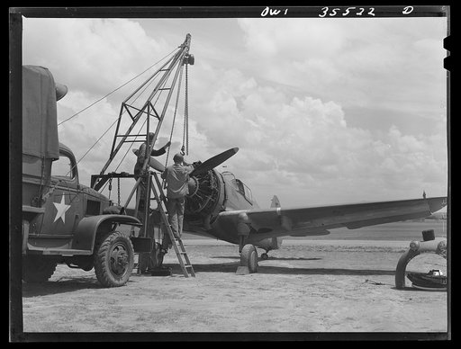 Untitled photo, possibly related to: Greenville, South Carolina. Air Service Command. Men of the 35th service squadron of the 25th service group removing the propeller of a plane