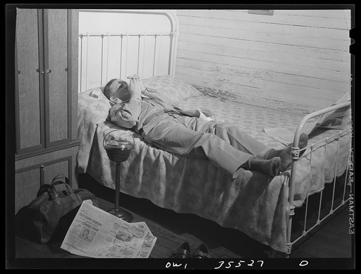 Untitled photo, possibly related to: Bowman, South Carolina. Sergeant John Riley, of the 25th service group, Air Service command, home on leave talking things over with his brother Howard