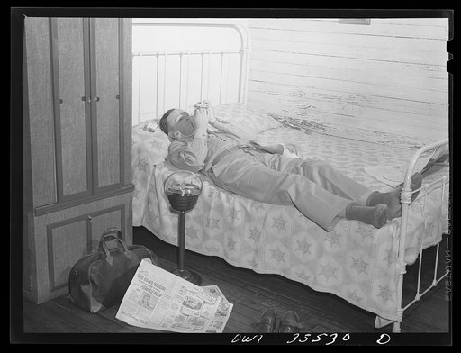 Untitled photo, possibly related to: Bowman, South Carolina. Sergeant John Riley, of the 25th service group, Air Service command, home on leave talking things over with his brother Howard
