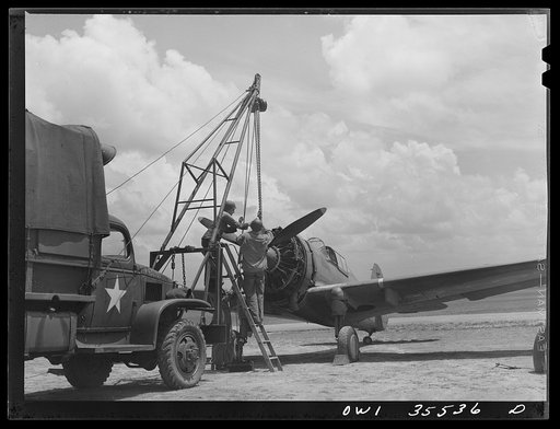 Greenville, South Carolina. Air Service Command. Men of the 35th service squadron of the 25th service group removing the propeller of a plane