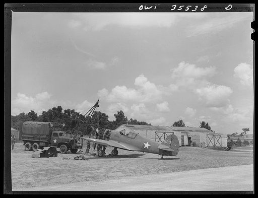 Greenville, South Carolina. Air Service Command. At the 25th service squadron engineering line. In the background are the shops camouflaged to look like farm buildings