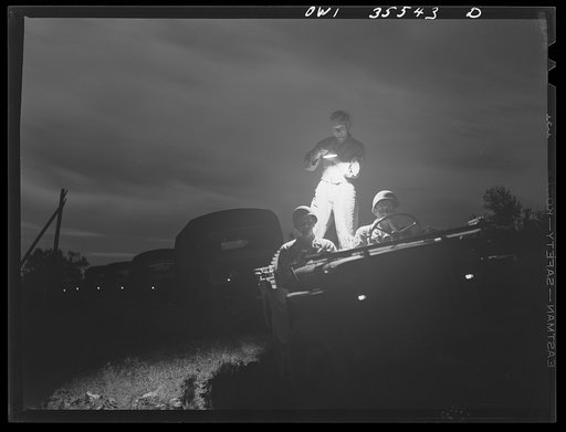 Robins Field, Warner Robins, Georgia. Convoy of trucks belonging to the Air Service Command practicing movement during a blackout