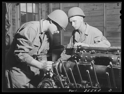 Greenville, South Carolina. Air Service Command. Sergeant John Riley of the 25th service group getting instruction on the Rolls Royce aircraft motor