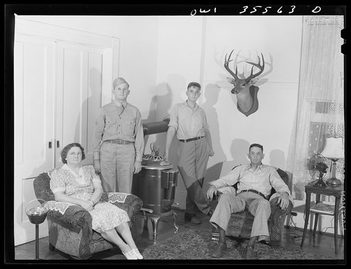 Bowman, South Carolina. Sergeant John Riley of the 25th service group, Air Service Command, at home on leave. With him are his father, Jacob Riley, his mother, Mrs. Kolly Riley, and his brother Howard. He also has a sister working in Washington D.C.