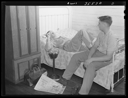 Bowman, South Carolina. Sergeant John Riley, of the 25th service group, Air Service command, home on leave talking things over with his brother Howard