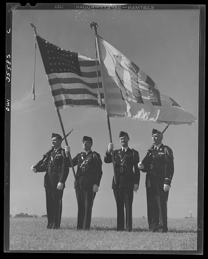 The United Nations flag, an unofficial design by Brooks B. Harding, with four bars symbolizing the Four Freedoms beside the Stars and Stripes