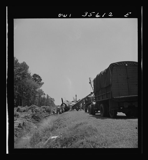Untitled photo, possibly related to: Myrtle Beach, South Carolina. Air Service Command. A mobile unit working on an A-20 which ran off a taxi strip