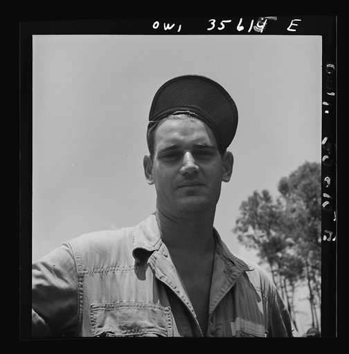 Untitled photo, possibly related to: Myrtle Beach, South Carolina. Air Service Command. Staff Sergeant L. W. Henderson, airplane mechanic with a mobile unit. His home was in Colorado City, Texas, where he worked as a pipeliner and oil field worker