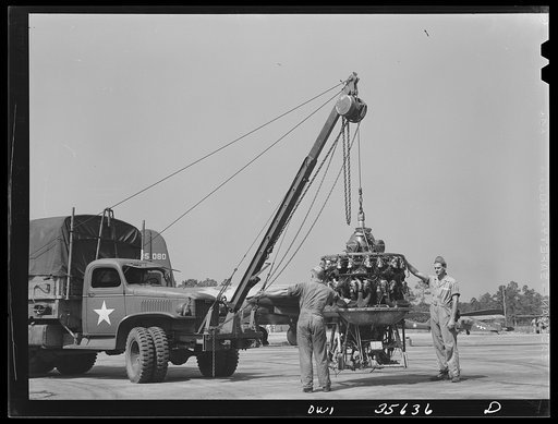 Myrtle Beach, South Carolina. Air Service Command. Mechanics of a mobile unit removing the engine of a plane