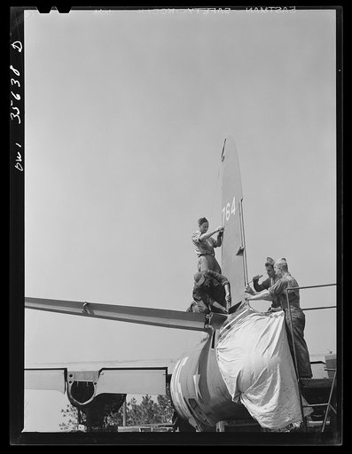 Myrtle Beach, South Carolina. Air Service Command. Airplane mechanics of a mobile unit working on the rudder of a B-26