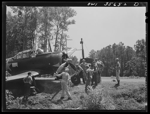 Untitled photo, possibly related to: Myrtle Beach, South Carolina. Air Service Command. A mobile unit working on an A-20 which ran off a taxi strip