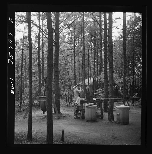 Greenville, South Carolina. Air Service Command. Enlisted men shaving in the wooded area occupied by the 25th service group