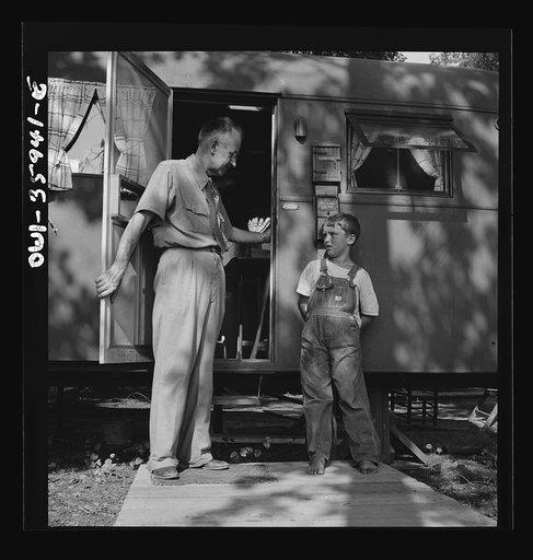 Untitled photo, possibly related to: Middle River, a small crossroads in the vicinity of Baltimore, Maryland. FSA (Farm Security Administration) housing project (later administered by the National Housing Agency) for Glenn L. Martin aircraft workers. Francis R. Casselman, the chaplain, with the smal