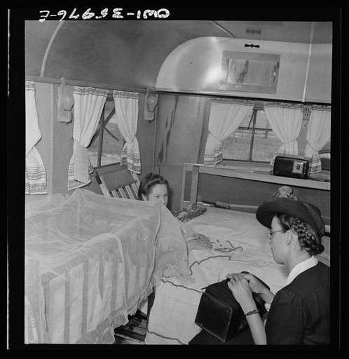 Middle River, a small crossroads in the vicinity of Baltimore, Maryland. FSA (Farm Security Administration) housing project (later administered by the National Housing Agency) for Glenn L. Martin aircraft workers. Mrs. George W. King and Mrs. Phyllis Phair, a public health nurse, talk over the probl