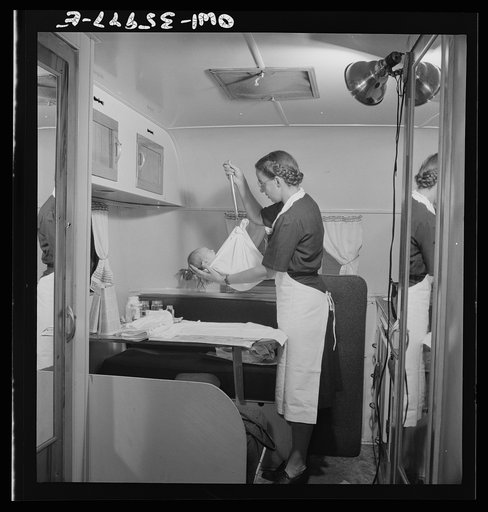 Middle River, a small crossroads in the vicinity of Baltimore, Maryland. FSA (Farm Security Administration) housing project (later administered by the National Housing Agency) for Glenn L. Martin aircraft workers. Mrs. Phyllis Phair, a public health nurse, demonstrating to a young mother how to bath