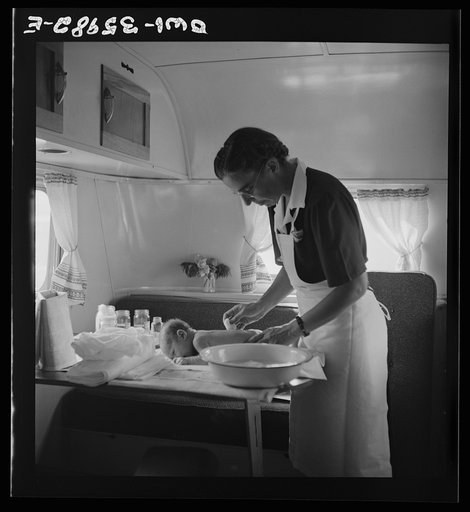 Middle River, a small crossroads in the vicinity of Baltimore, Maryland. FSA (Farm Security Administration) housing project (later administered by the National Housing Agency) for Glenn L. Martin aircraft workers. Mrs. Phyllis Phair, a public health nurse, demonstrating to a young mother how to bath