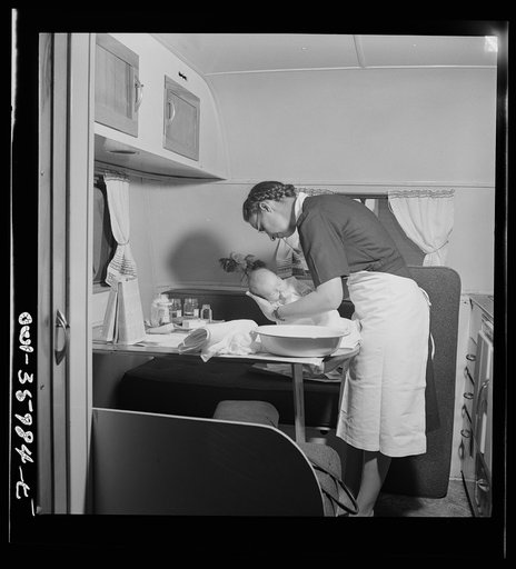 Middle River, a small crossroads in the vicinity of Baltimore, Maryland. FSA (Farm Security Administration) housing project (later administered by the National Housing Agency) for Glenn L. Martin aircraft workers. Mrs. Phyllis Phair, a public health nurse, demonstrating to a young mother how to bath