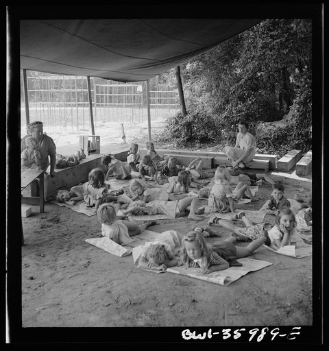 Untitled photo, possibly related to: Middle River, a small crossroads in the vicinity of Baltimore, Maryland. FSA (Farm Security Administration) housing project (later administrated by the National Housing Agency) for Glenn L. Martin aircraft workers. Children at rest in the playground