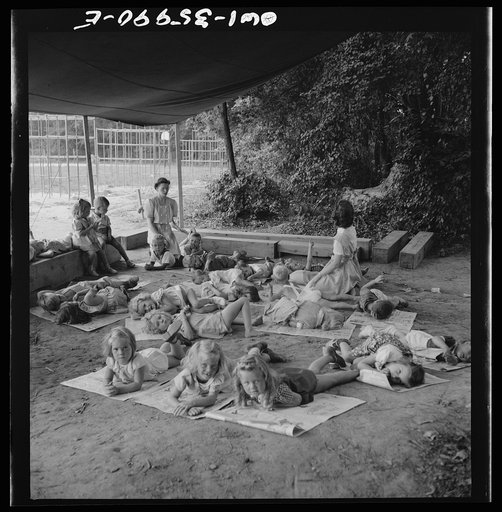 Middle River, a small crossroads in the vicinity of Baltimore, Maryland. FSA (Farm Security Administration) housing project (later administrated by the National Housing Agency) for Glenn L. Martin aircraft workers. Children at rest in the playground