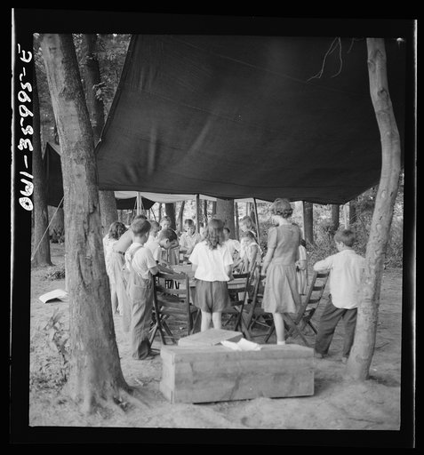 Untitled photo, possibly related to: Middle River, a small crossroads in the vicinity of Baltimore, Maryland. FSA (Farm Security Administration) housing project (later administered by the National Housing Agency) for Glenn L. Martin aircraft workers. Children attending daily Bible class in their dai