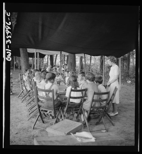 Untitled photo, possibly related to: Middle River, a small crossroads in the vicinity of Baltimore, Maryland. FSA (Farm Security Administration) housing project (later administered by the National Housing Agency) for Glenn L. Martin aircraft workers. Children attending daily Bible class in their dai