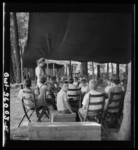 Untitled photo, possibly related to: Middle River, a small crossroads in the vicinity of Baltimore, Maryland. FSA (Farm Security Administration) housing project (later administered by the National Housing Agency) for Glenn L. Martin aircraft workers. Children attending daily Bible class in their dai
