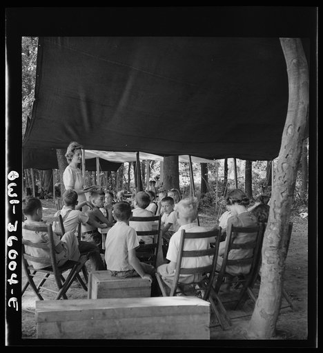 Middle River, a small crossroads in the vicinity of Baltimore, Maryland. FSA (Farm Security Administration) housing project (later administered by the National Housing Agency) for Glenn L. Martin aircraft workers. Children attending daily Bible class in their daily rest period, under the direction o