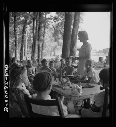 Untitled photo, possibly related to: Middle River, a small crossroads in the vicinity of Baltimore, Maryland. FSA (Farm Security Administration) housing project (later administered by the National Housing Agency) for Glenn L. Martin aircraft workers. Children attending daily Bible class in their dai