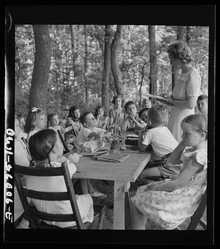 Middle River, a small crossroads in the vicinity of Baltimore, Maryland. FSA (Farm Security Administration) housing project (later administered by the National Housing Agency) for Glenn L. Martin aircraft workers. Children attending daily Bible class in their daily rest period, under the direction o