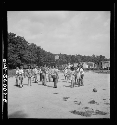 Untitled photo, possibly related to: Middle River, a small crossroads in the vicinity of Baltimore, Maryland. FSA (Farm Security Administration) housing project (later administered by the National Housing Agency) for Glenn L. Martin aircraft workers. Children who attend summer Bible class playing in